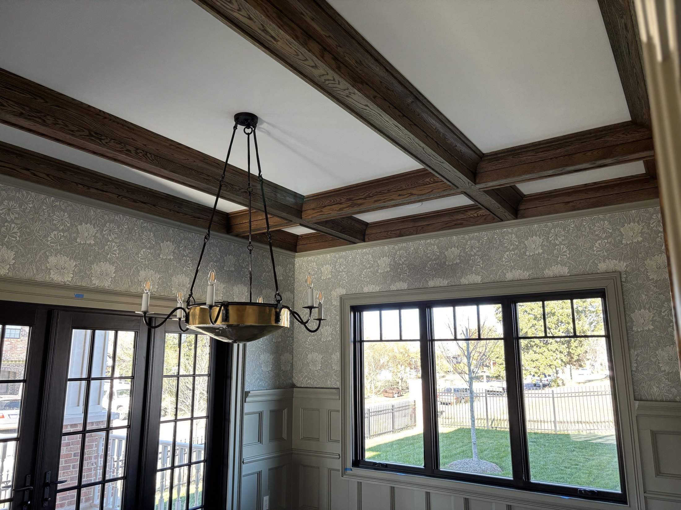 Dining room with exposed oak ceiling beams and crown detail