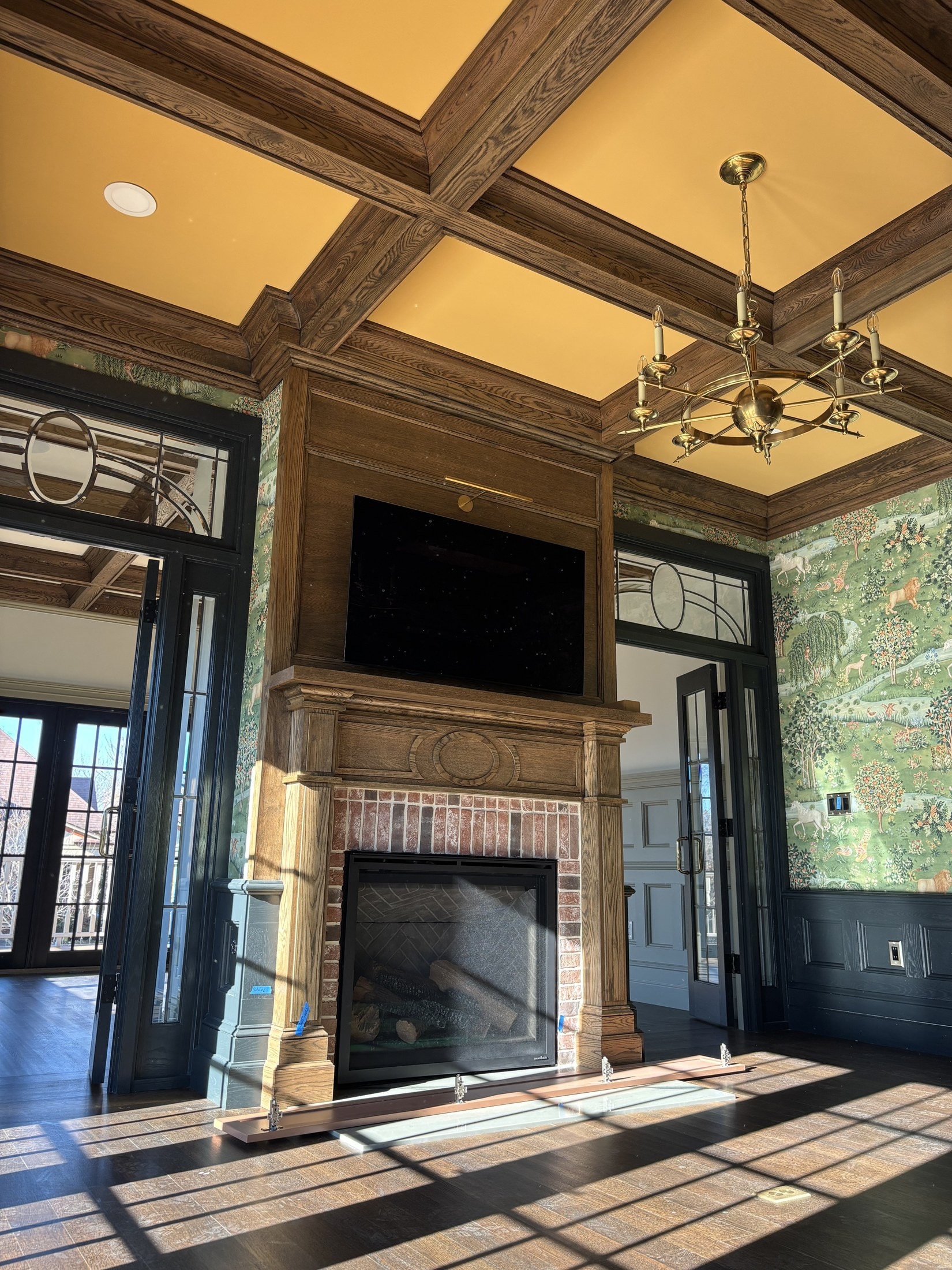 Tight detail of a great-room fireplace surround and panel work