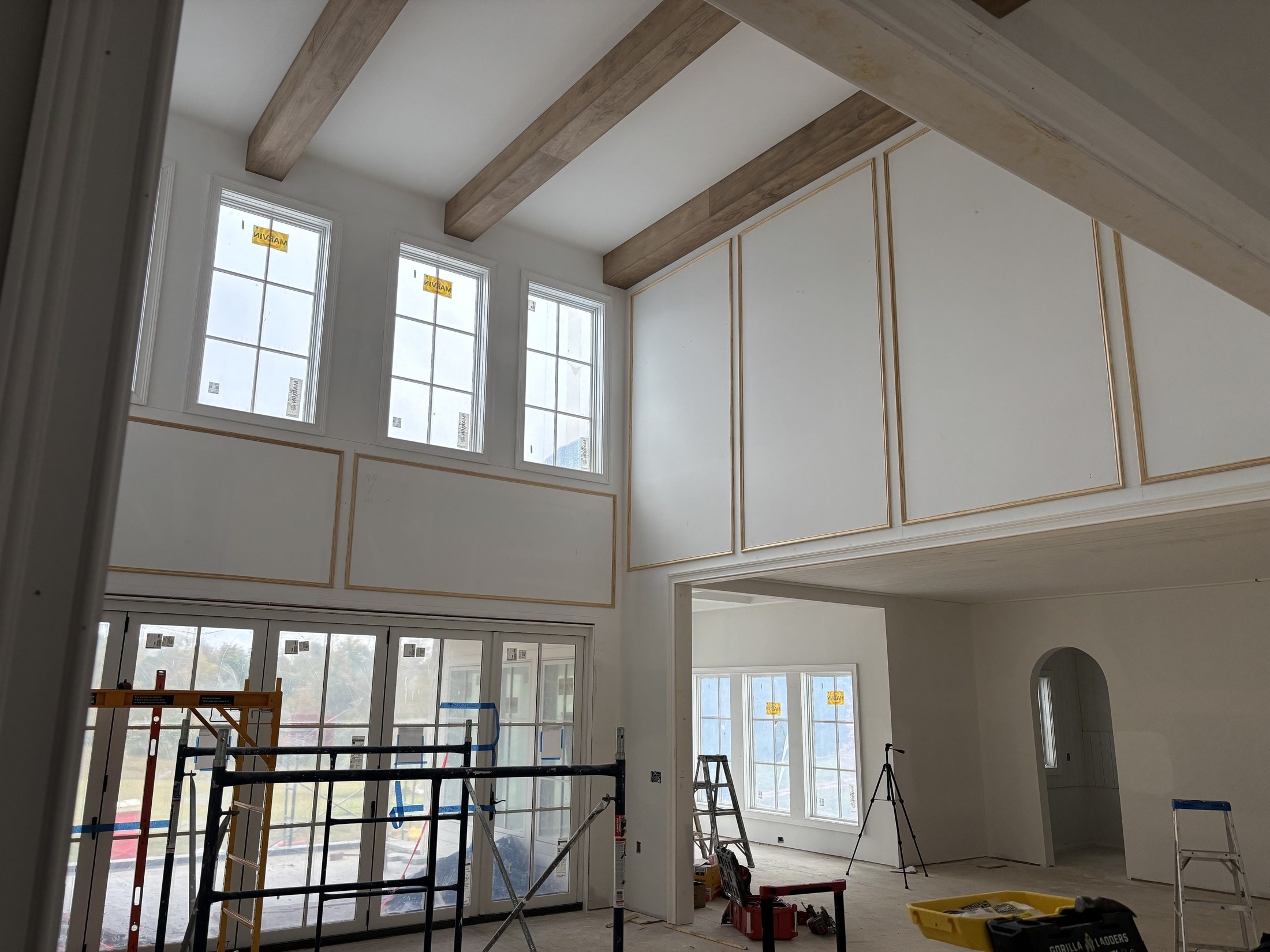 Two-story great room with picture-frame wainscoting in progress