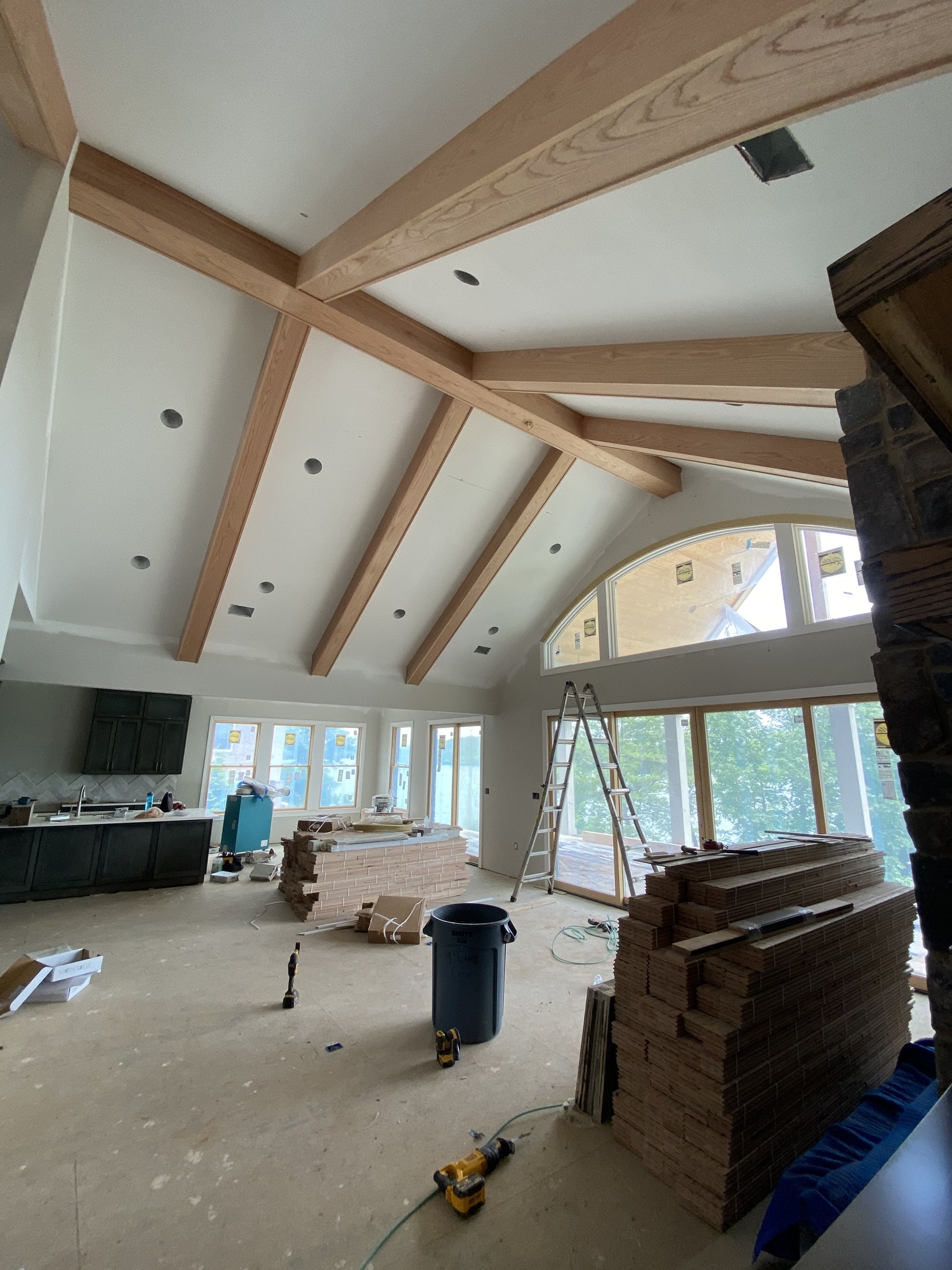 Vaulted stair void with exposed cedar ceiling beams under construction